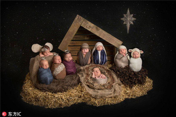 摄影师为新生儿拍照 重演基督诞生场景